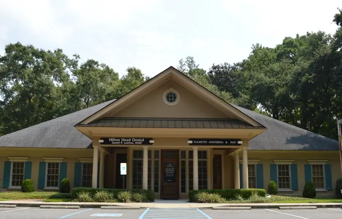 The Hilton Head Dental office at 222 Pembroke Drive, with the practice's name and Dr. Lawless's on the sign above the porch.